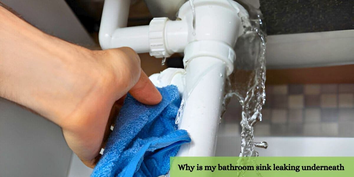 Plumbing issue: A person attempting to stop water leaking from a broken bathroom sink pipe