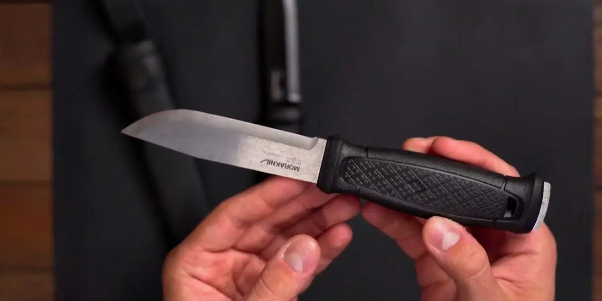 a-man-prepares-to-sharpen-a-morakniv-knife